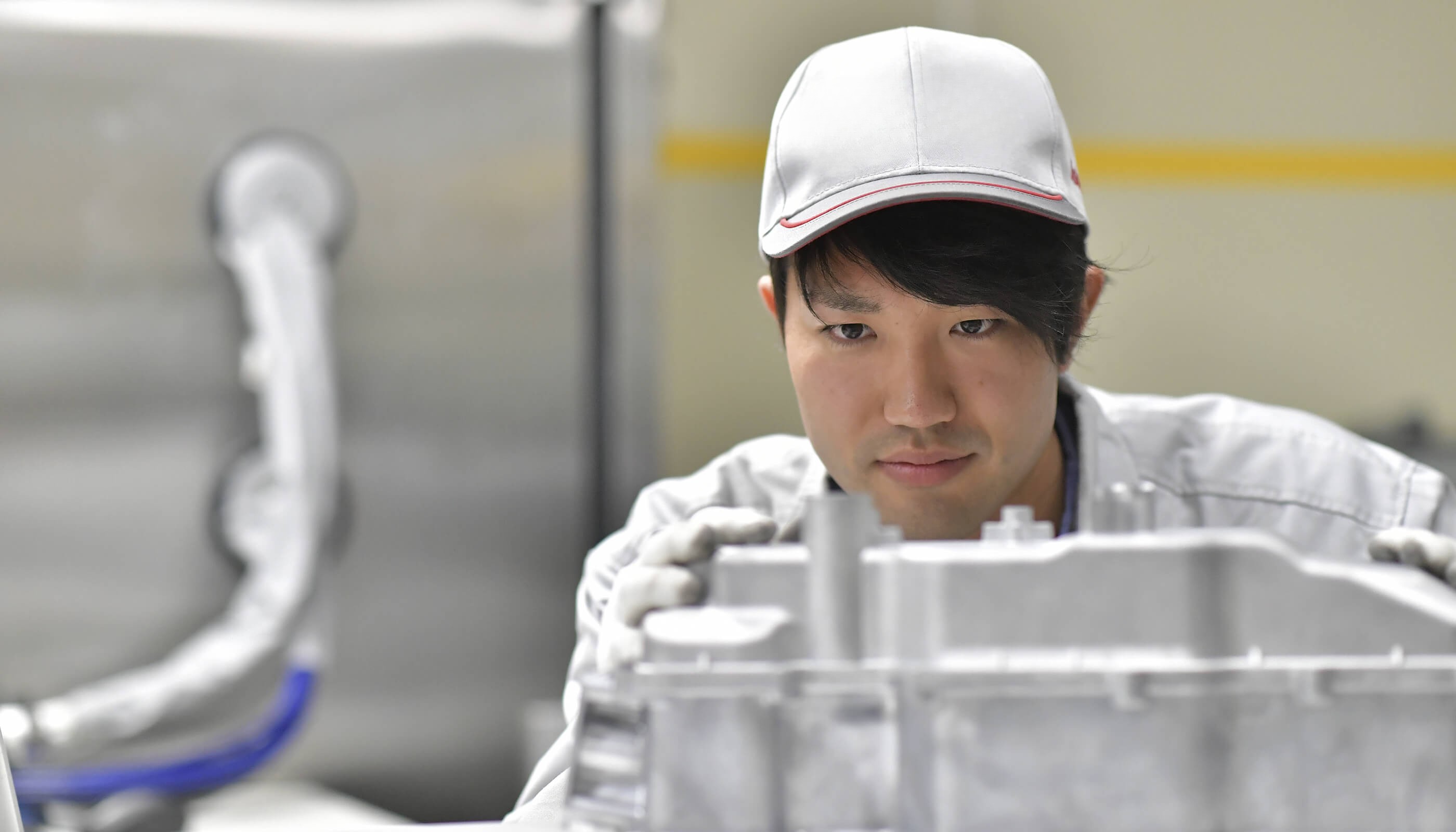 a person wearing a white hat and gloves