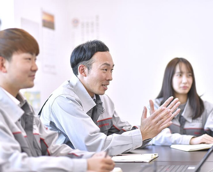 a group of people in a meeting