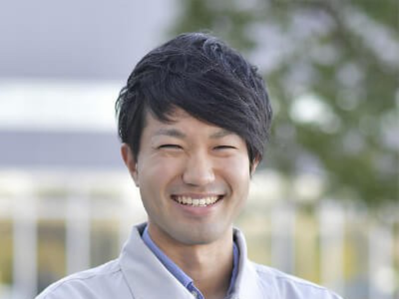 a person smiling at the camera