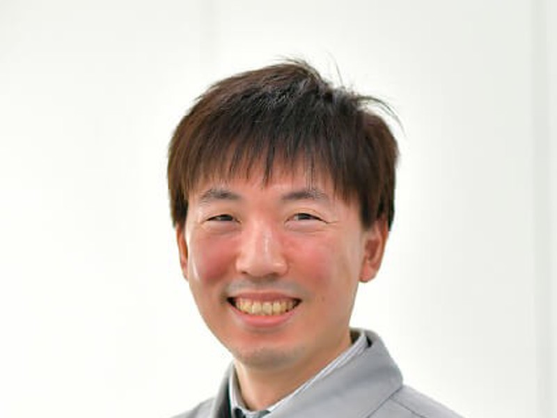 a person smiling at the camera