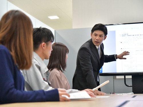a person standing in front of a screen