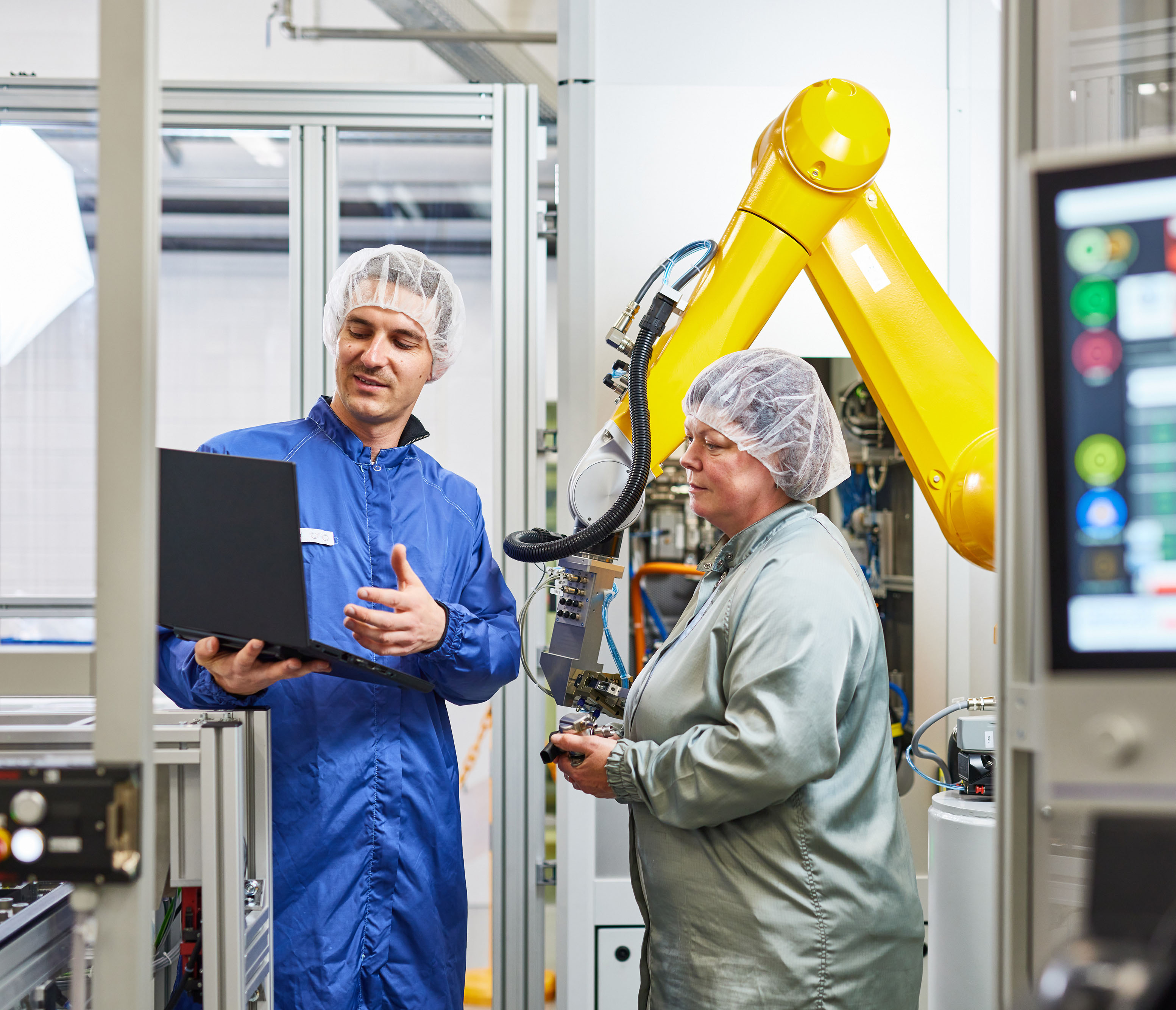 a person and person in a factory