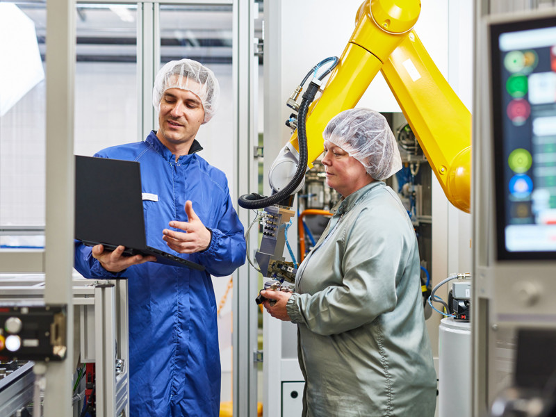 a person and person in a factory