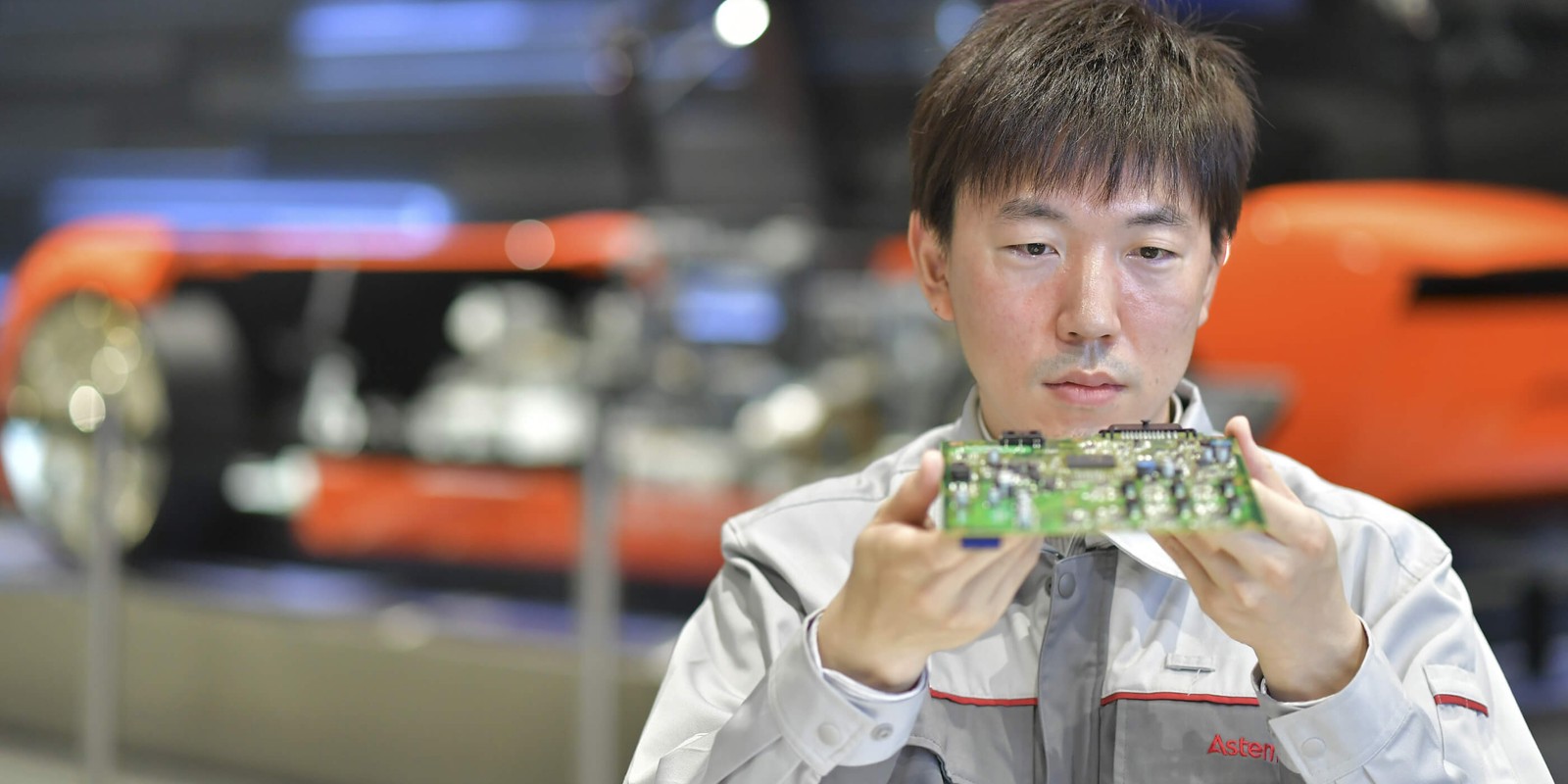 a person holding a green object