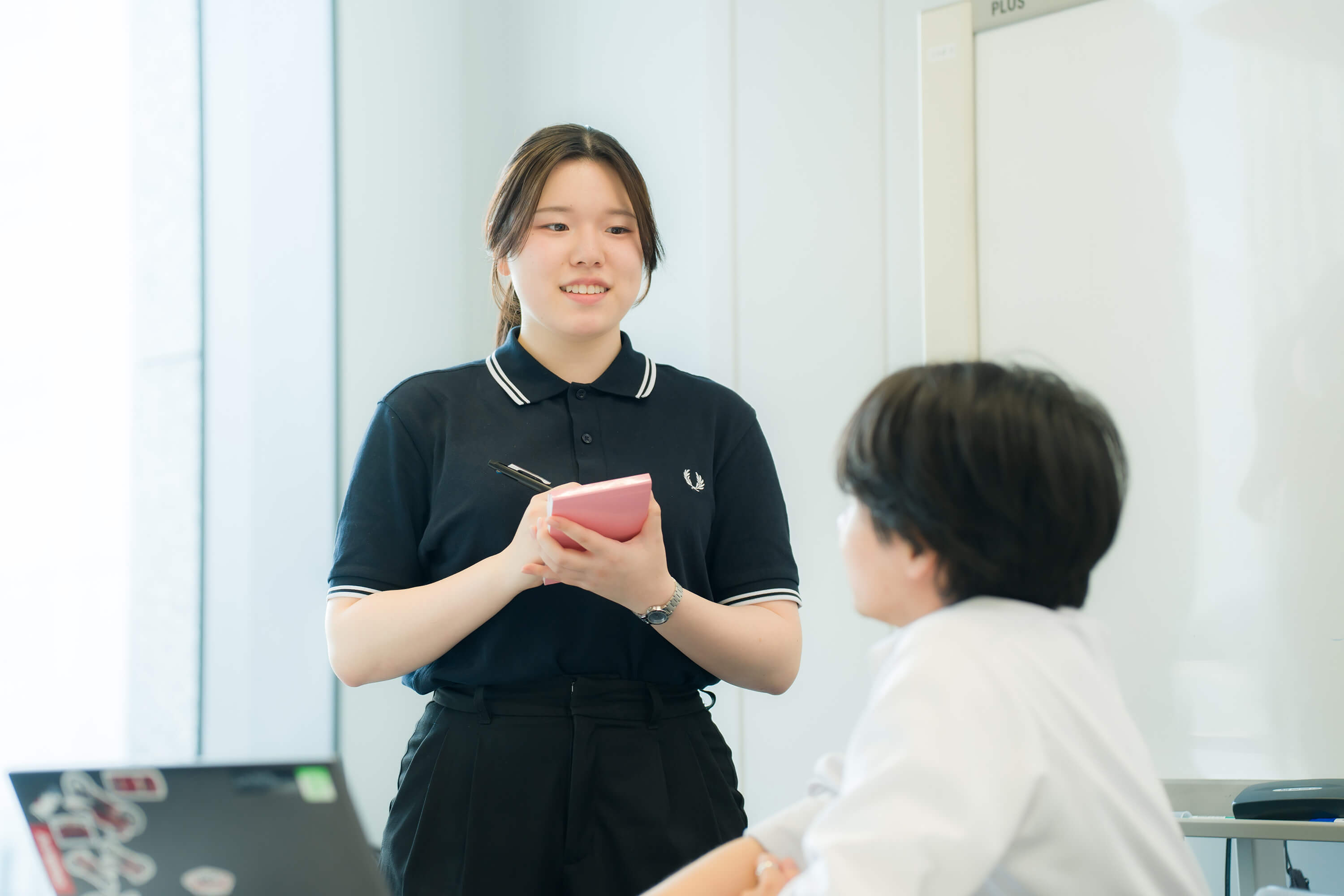 A woman taking notes