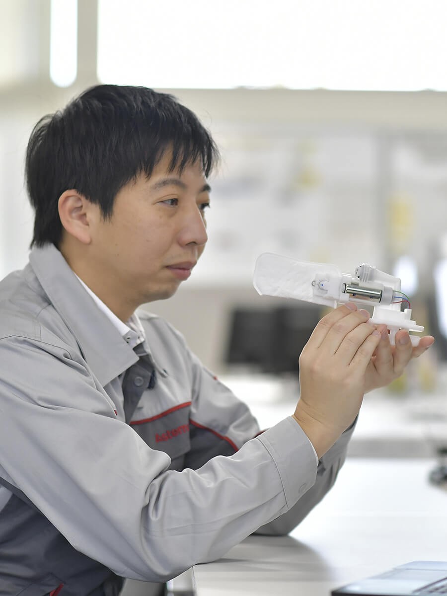 a person holding a small object