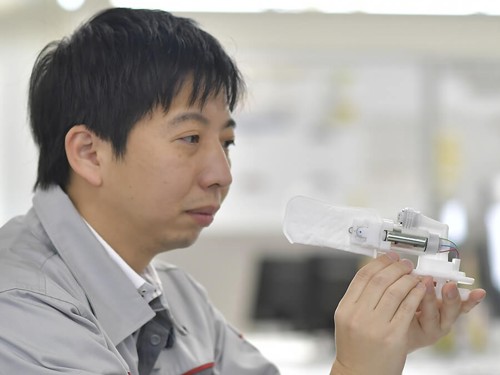 a person holding a small object