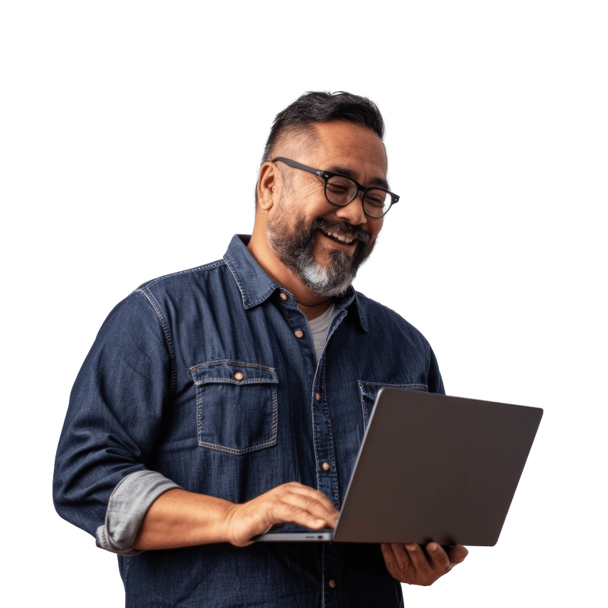 a person smiling while holding a laptop