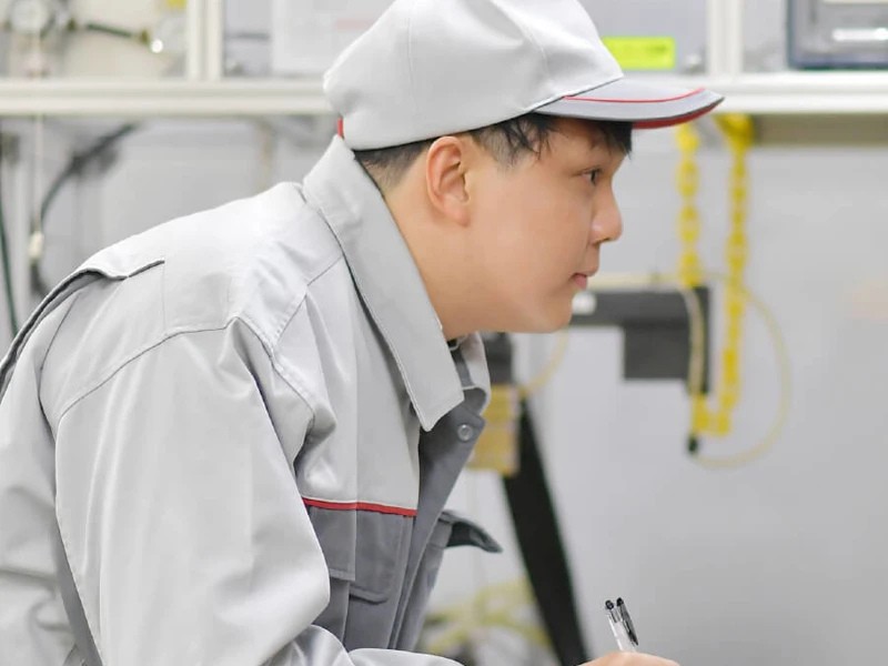 a person in a grey uniform