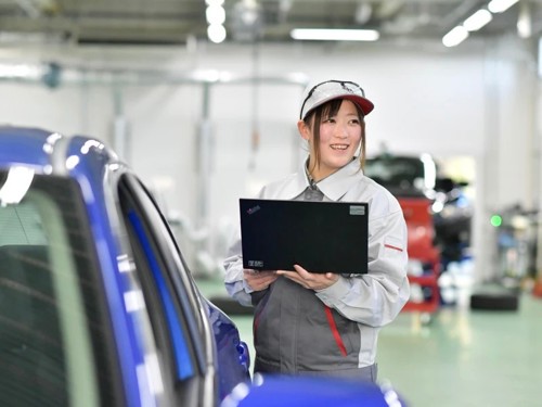 a person holding a laptop