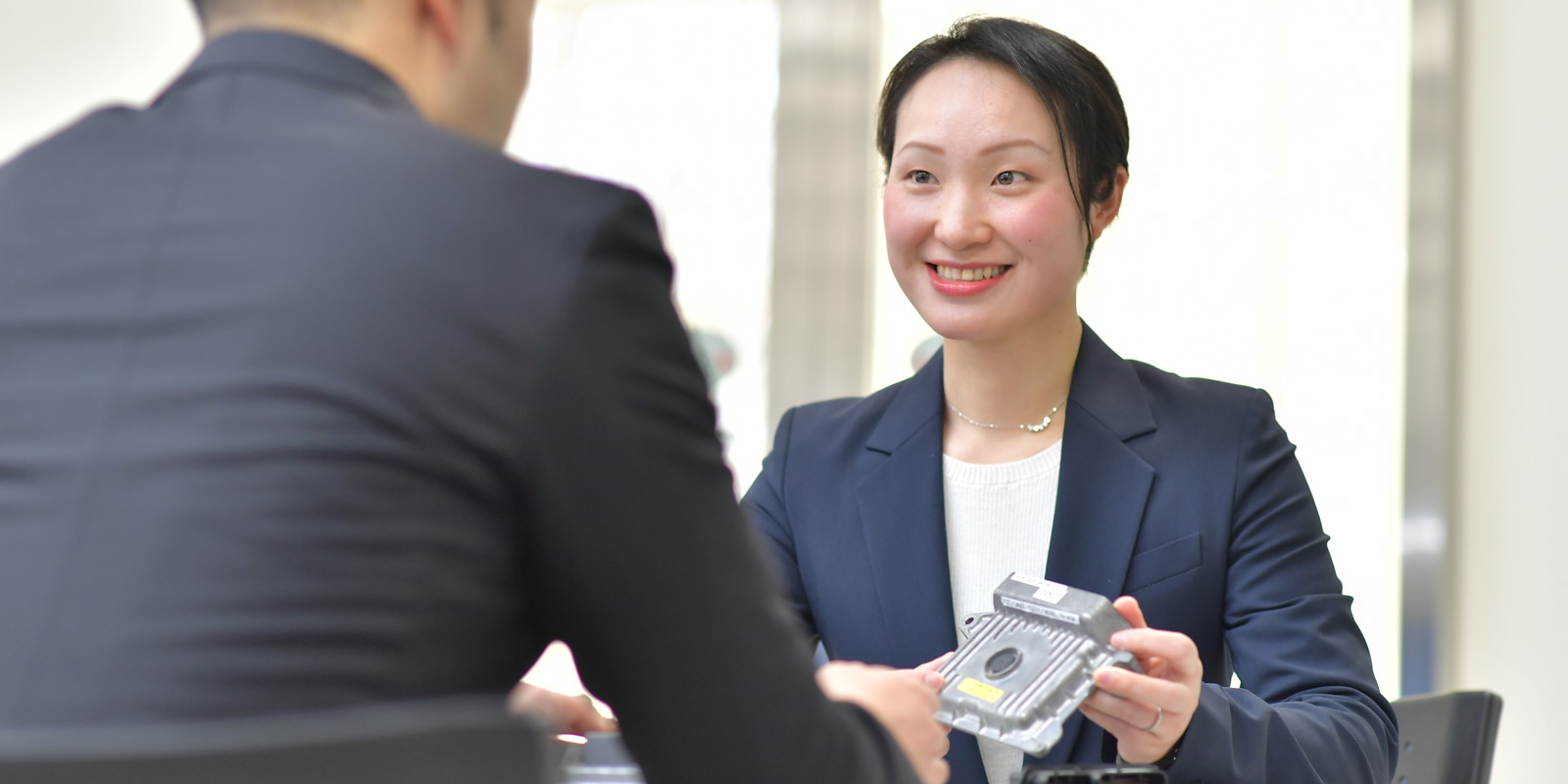 a person holding a device to a person